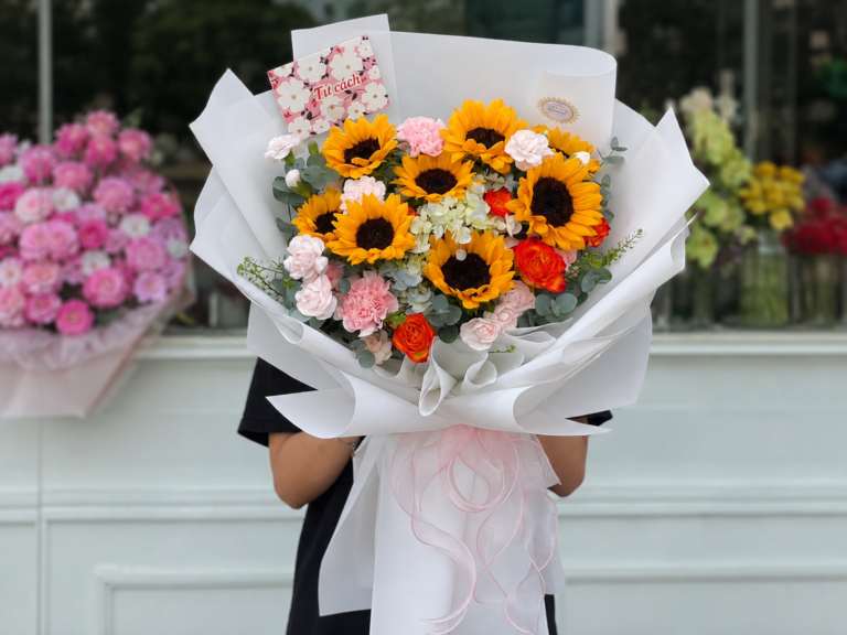 Bó hoa hướng dương kết hợp cẩm chướng trắng hồng